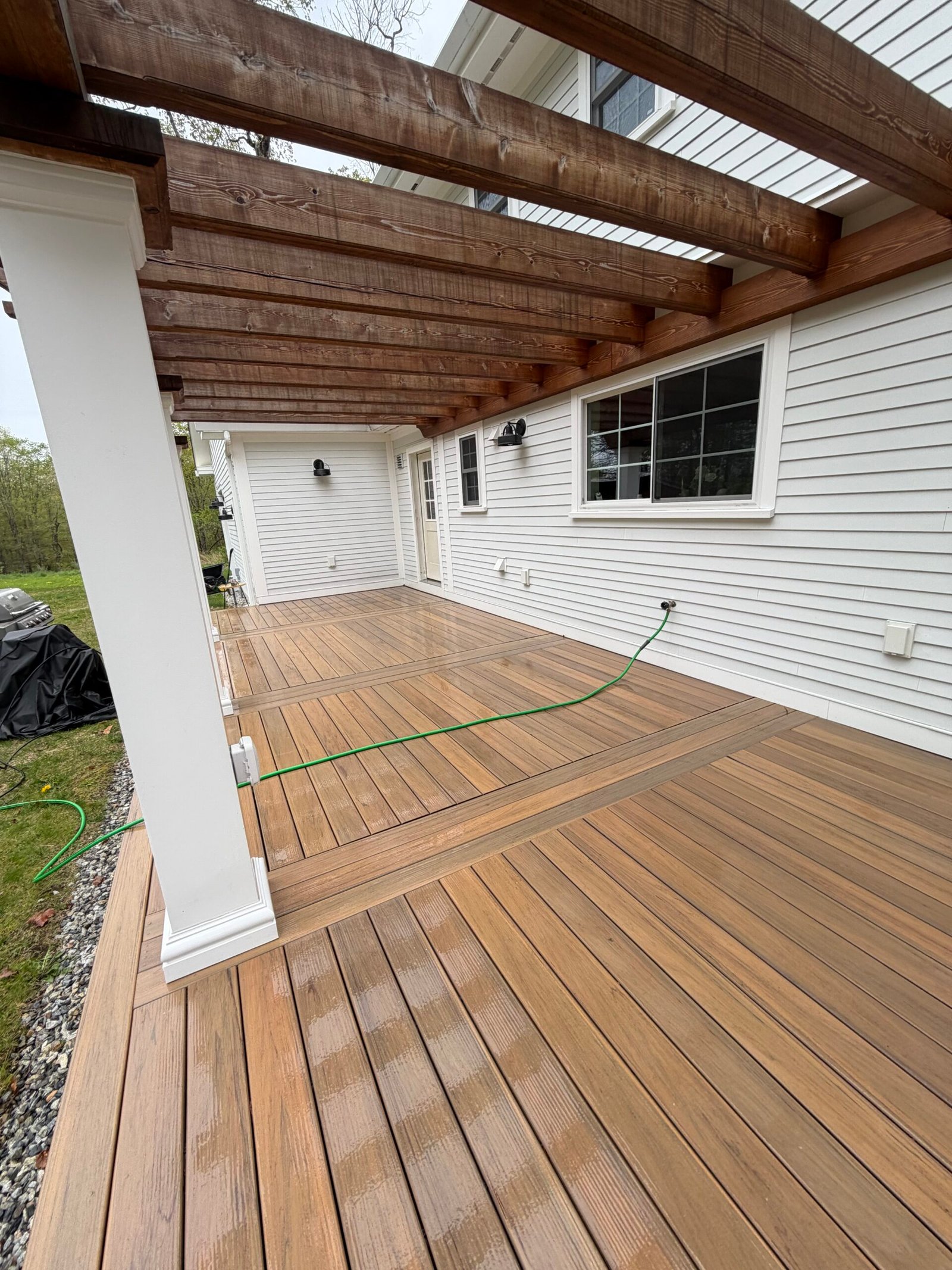 Clean wooden deck after exterior pressure washing